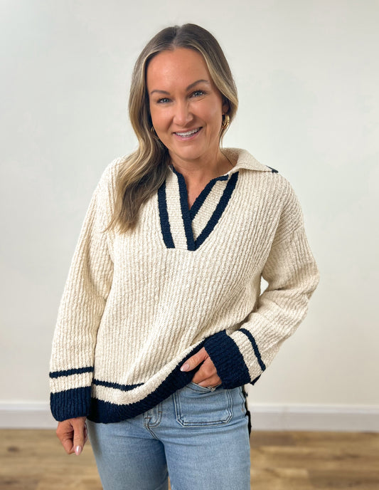 cream and navy v neck varsity sweater